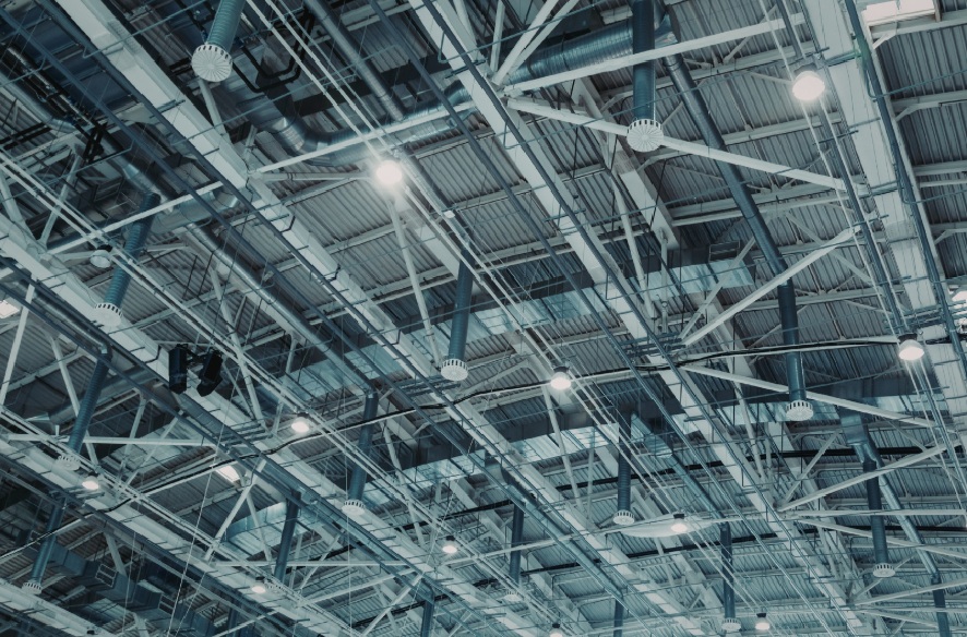 Warehouse ceiling with high-bay LED lighting fixtures