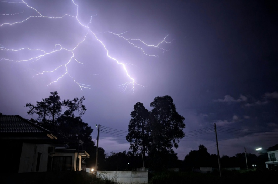 Lightning storm over a residential neighborhood at night