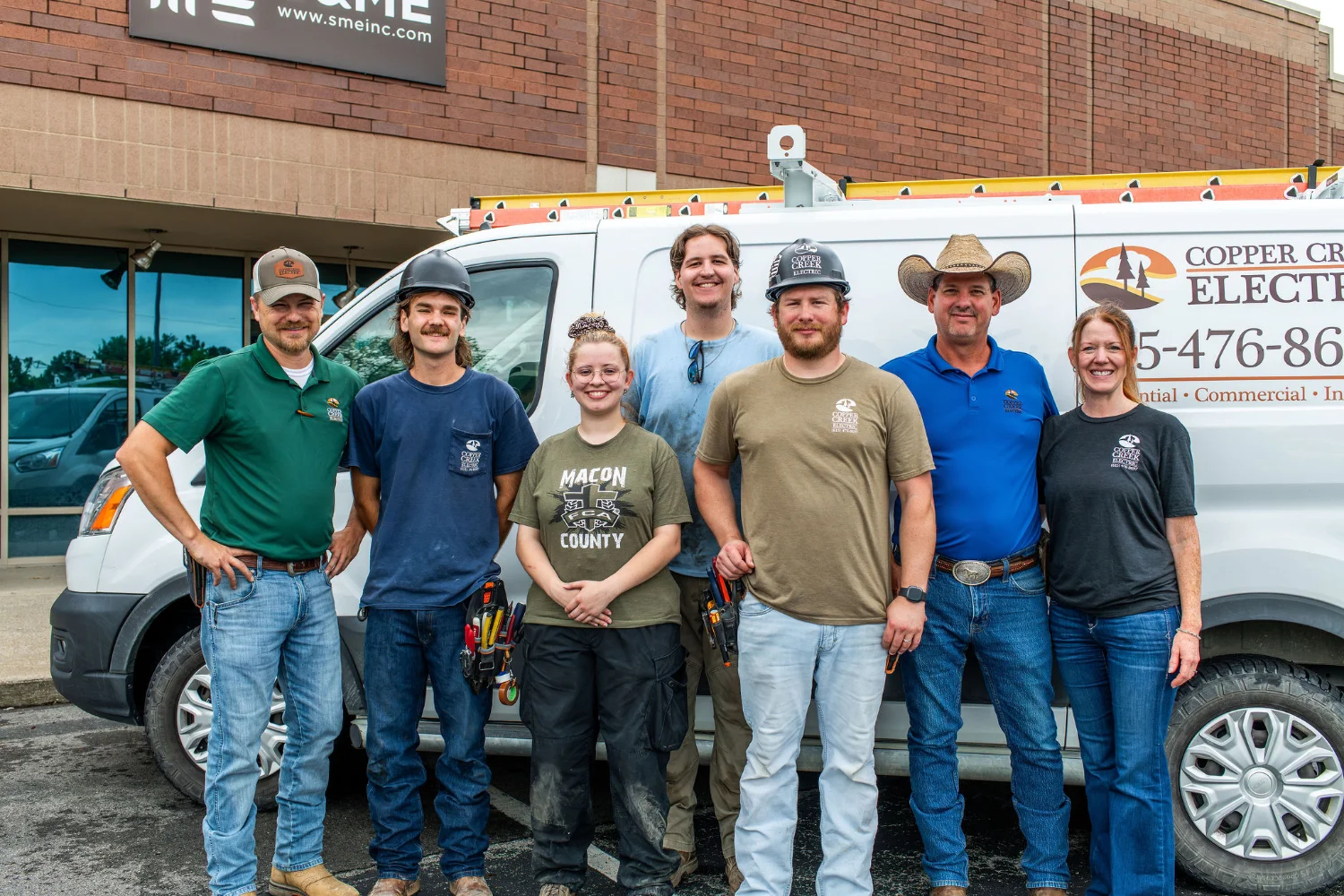 Copper Creek Electric team standing in front of a company service van, Electric repair and installation services, Goodlettsville, TN.