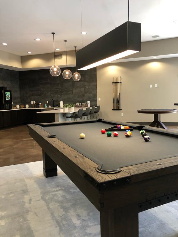 Finished lighting installation in an apartment community clubhouse lounge